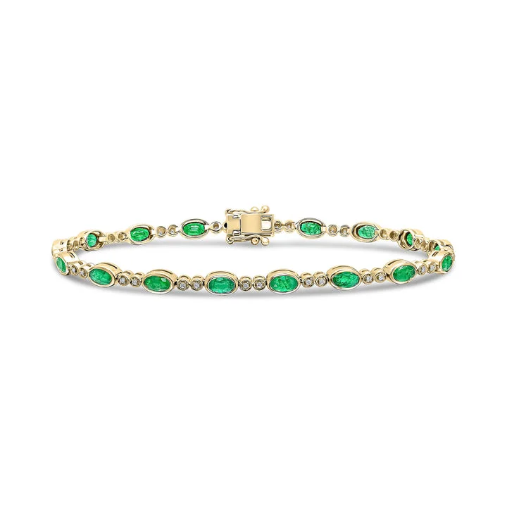 18ct Gold yellow and white gold oval emerald and brilliant cut diamond bracelet